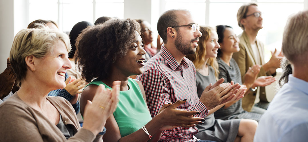 blog-featured_retirement-plan-meeting_1030x500 group of people clapping in meeting
