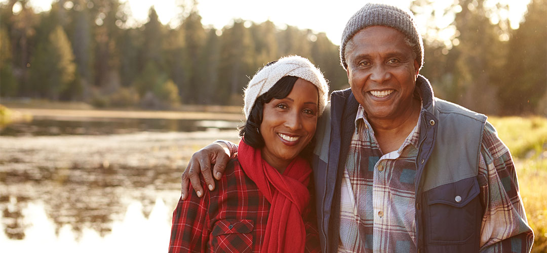 blog-featured_wealth-insights-september_1030x500 couple standing in front of pond