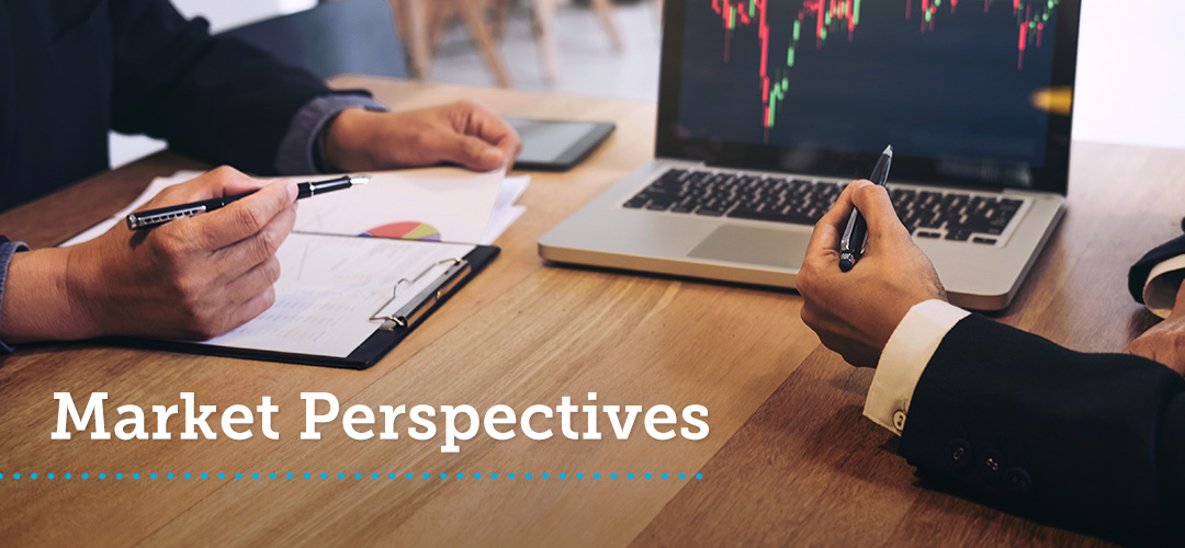 blog-featured_wealth-market-perspectives_1080x500 Two men sit at a desk and examine a graph on a laptop