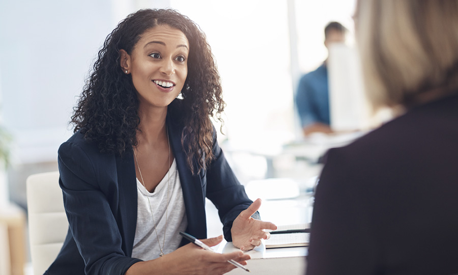 Woman in a business meeting talking with a client