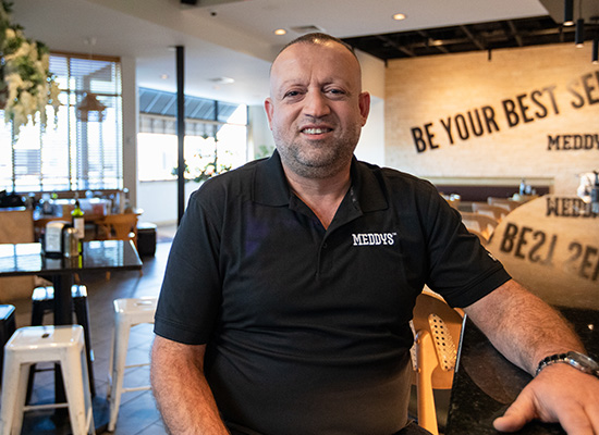 Meddy's owner smiling at camera