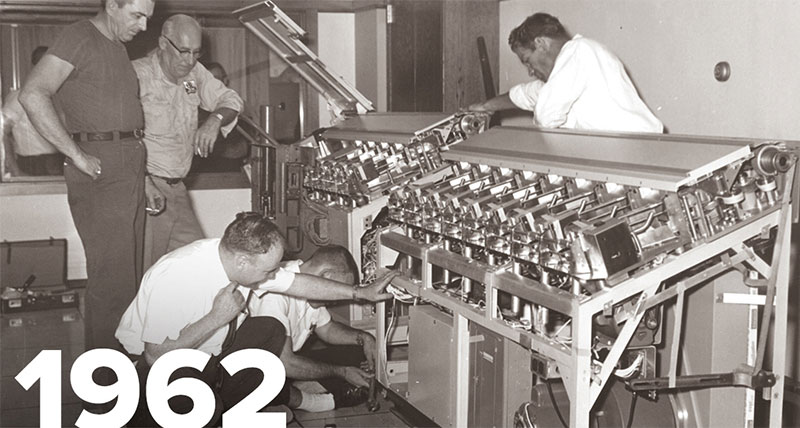 Image of people installing first computer at the company